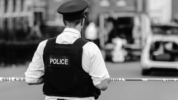 Police officer stands guard at a police cordon
